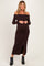 woman wearing a brown off-shoulder ribbed maternity dress with button details and a visible baby bump