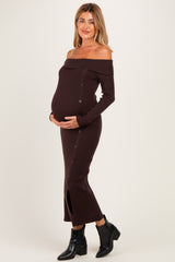 woman wearing a brown off-shoulder ribbed maternity dress with buttons and a visible baby bump