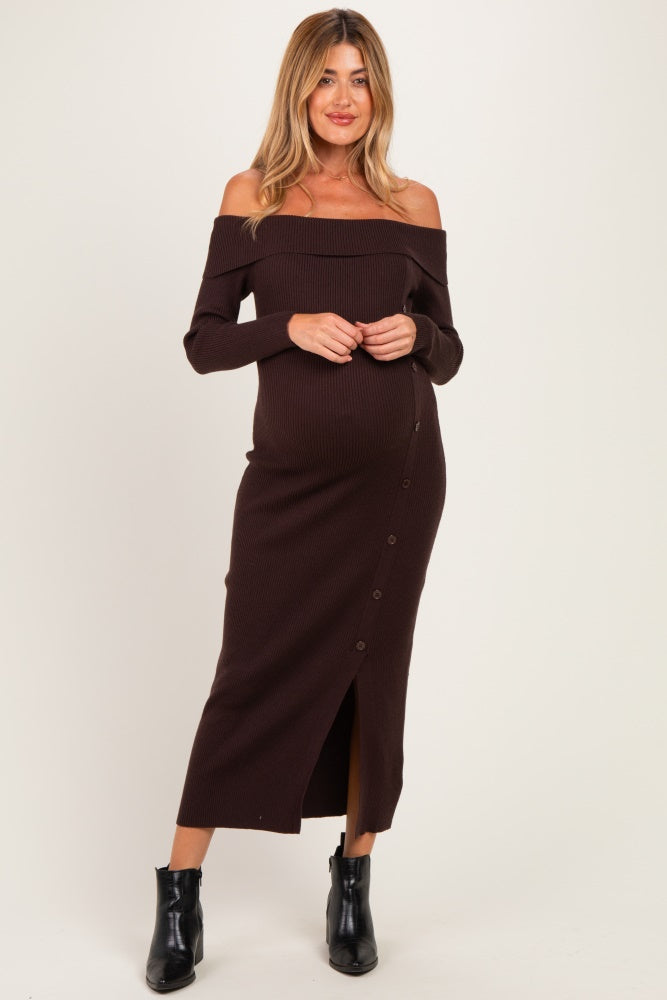 woman wearing a brown off-shoulder ribbed maternity dress with button details and a visible baby bump