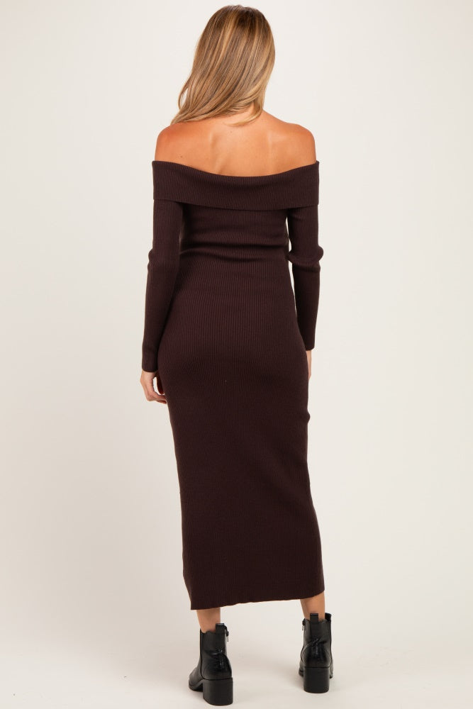 woman wearing a brown off-shoulder ribbed maternity dress with long sleeves and a fitted silhouette