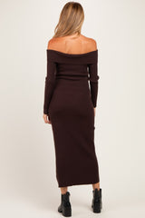 woman wearing a brown off-shoulder ribbed maternity dress with long sleeves and a fitted silhouette