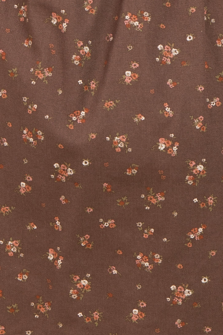 brown floral fabric with small multicolored flowers scattered throughout