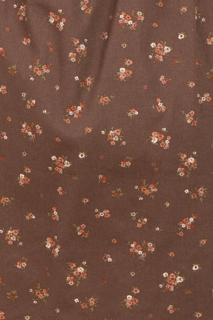 brown floral fabric with small multicolored flowers scattered throughout