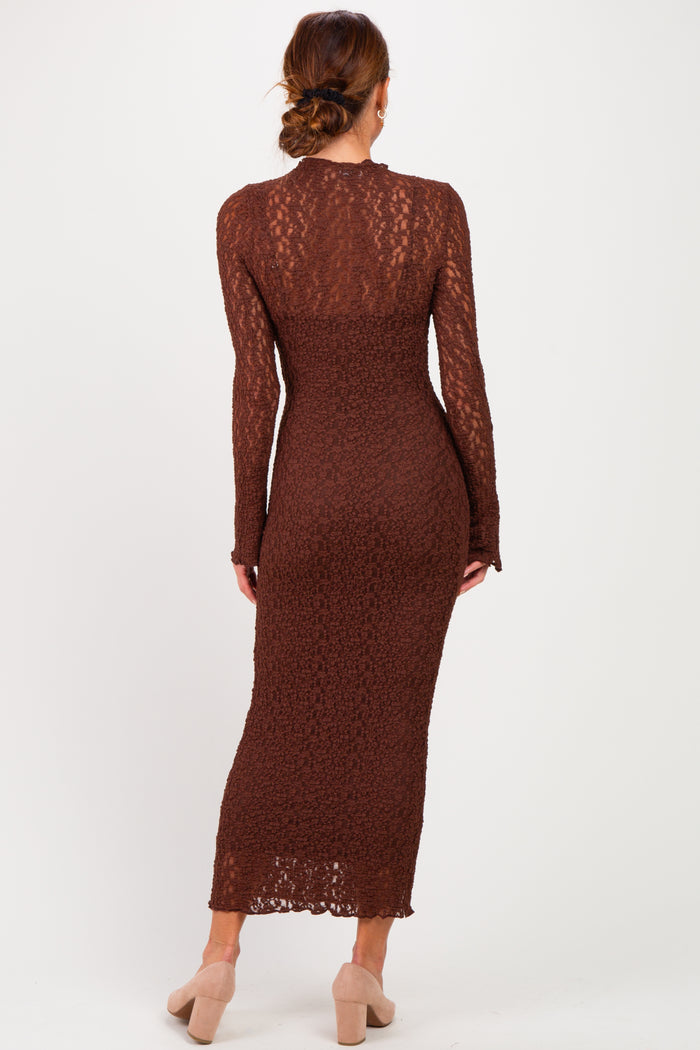 woman wearing a brown long sleeve midi dress with a lace overlay and fitted silhouette, view from the back