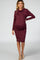 woman wearing a burgundy long sleeve maternity dress with a cowl neck and side ruching, showcasing her baby bump