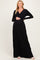 woman wearing a black long sleeve maternity dress and showing her baby bump