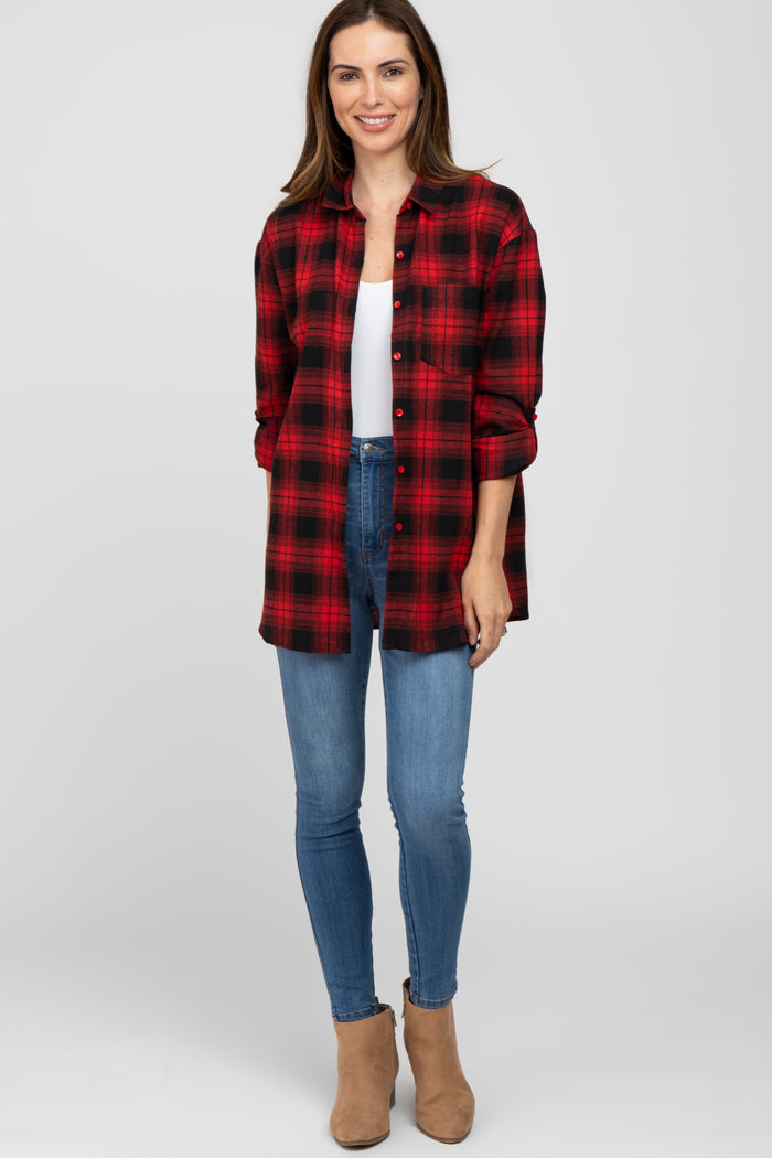 woman wearing a red and black plaid shirt, white tank top, blue skinny jeans, and tan ankle boots