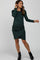 woman wearing a dark green long sleeve maternity dress with a ruched side and a visible baby bump