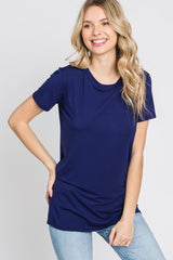 woman wearing a navy blue short sleeve t-shirt with a round neckline and relaxed fit