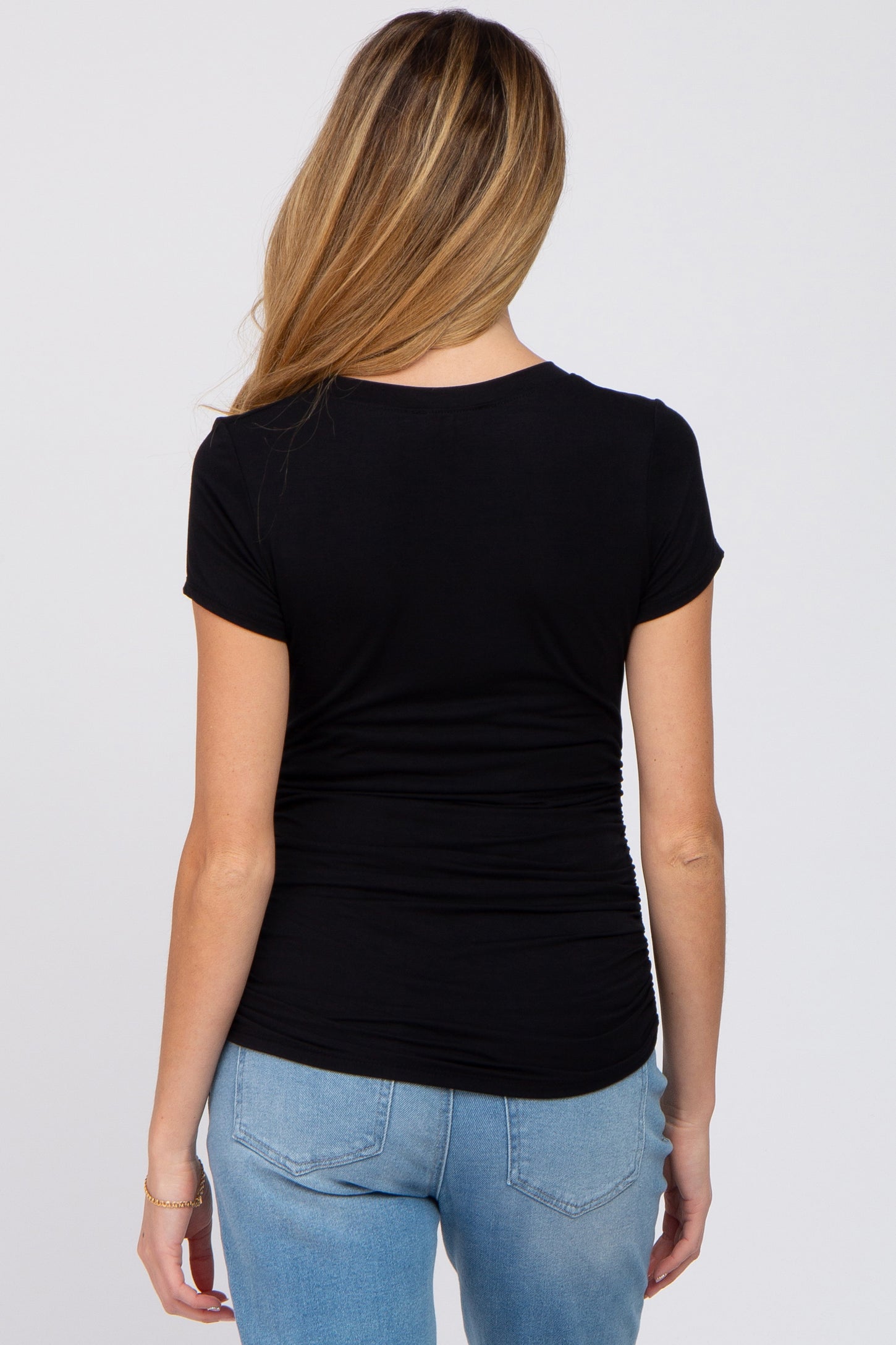 maternity wear black fitted short sleeve top with gathered detailing on the sides, model shown from the back