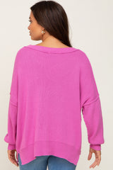 woman wearing a lavender oversized maternity sweater from the back with loose sleeves and a relaxed fit