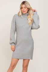 woman wearing a gray ribbed turtleneck mini dress with long sleeves