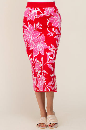woman wearing a red floral-printed midi skirt with a ribbed waistband and a fitted silhouette