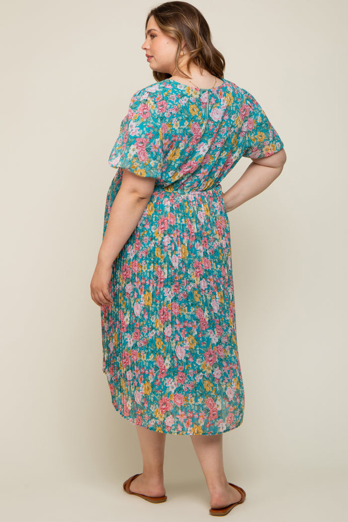 woman wearing a floral print maternity dress with short sleeves and a pleated skirt, showing a baby bump from the back