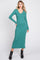 woman wearing a green ribbed long sleeve midi dress with a v-neckline and styled with black ankle boots