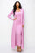 woman wearing a light pink ribbed two-piece dress with a long cardigan and strappy sandals