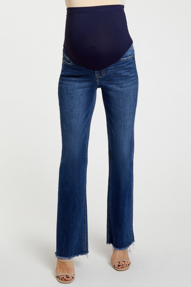 woman wearing dark blue maternity flare jeans with a supportive over-the-bump waistband