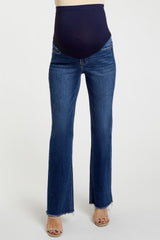 woman wearing dark blue maternity flare jeans with a supportive over-the-bump waistband
