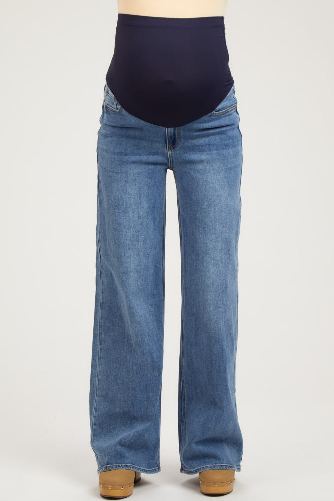 maternity wear blue wide leg jeans with a dark navy belly panel and no visible baby bump
