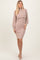woman wearing a taupe ribbed long sleeve dress with a mock neck and fitted silhouette