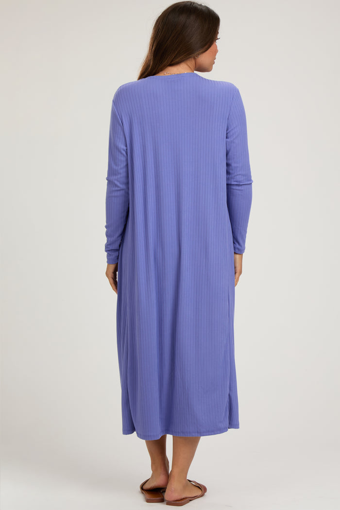 woman wearing a long sleeve purple maternity dress with a relaxed fit and side slits, showing a baby bump