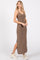 woman wearing a light brown ribbed maxi dress with side slits and spaghetti straps