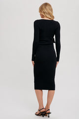 woman wearing a black ribbed knit two-piece dress with a long sleeve top and fitted midi skirt, viewed from the back