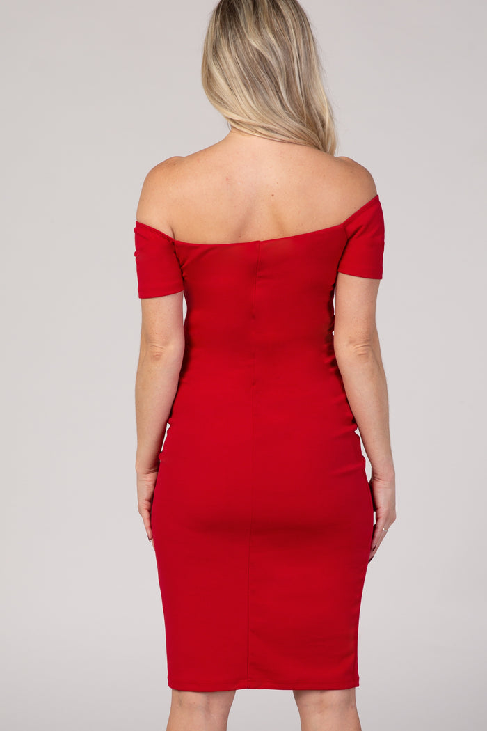 woman wearing a red off-the-shoulder maternity dress, fitted style, seen from the back