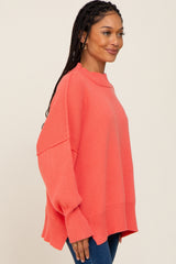 Coral Mock Neck Exposed Seam Sweater