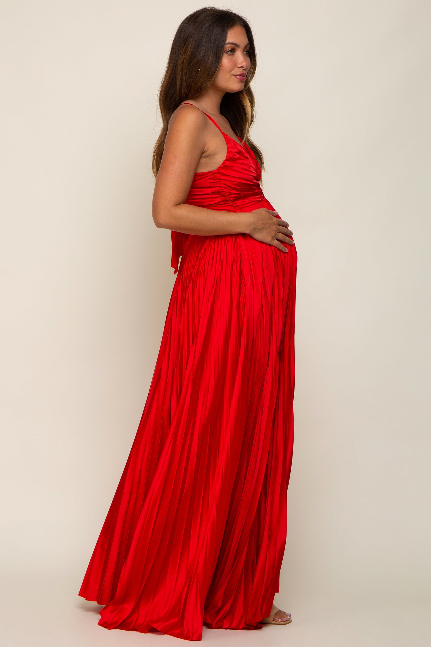 Beautiful mamma to be in our New Red Maternity Gown complementing the  beautiful floral backdrop